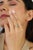 This wavy band ring showcases 0.74 carat pear shape turquoise set in 18K yellow gold. The cabochon turquoise measures 7 x...