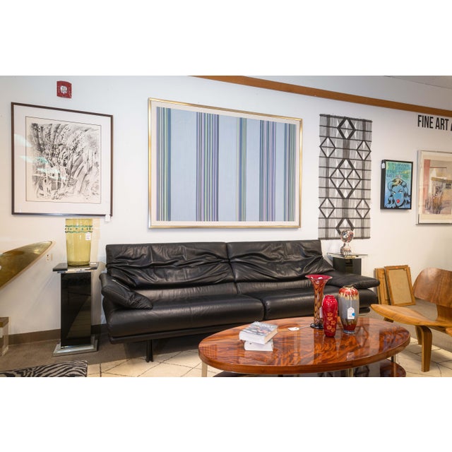 A postmodern Alanda loveseat by Paola Pive for B&B Italia. This beautiful black leather loveseat features a fantastic...