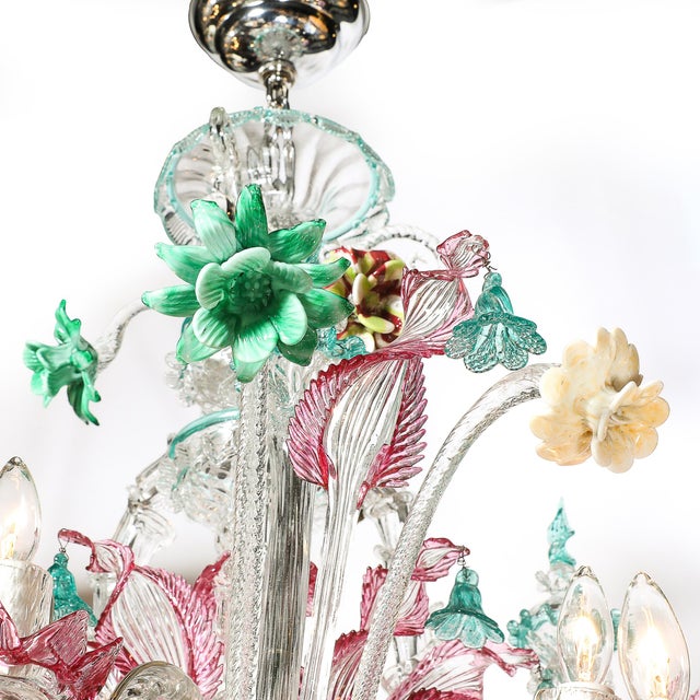 An exceptional and rare Mid-Century classical Murano twelve-arm chandelier, masterfully hand-blown in transparent,...