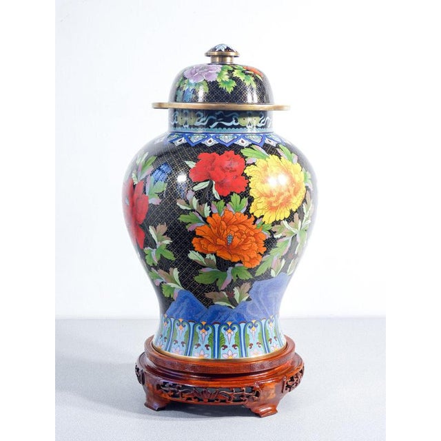 Large vase with cloisonné enamel lid. Origin china period 20th century materials copper, cloisonné enamel, wooden base...