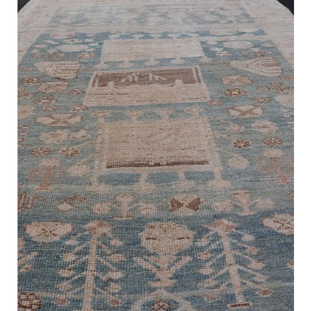 Antique Kurdish rug with tribal geometric medallions in soft blue, cream, light blue, medium blue with hint of teal,...