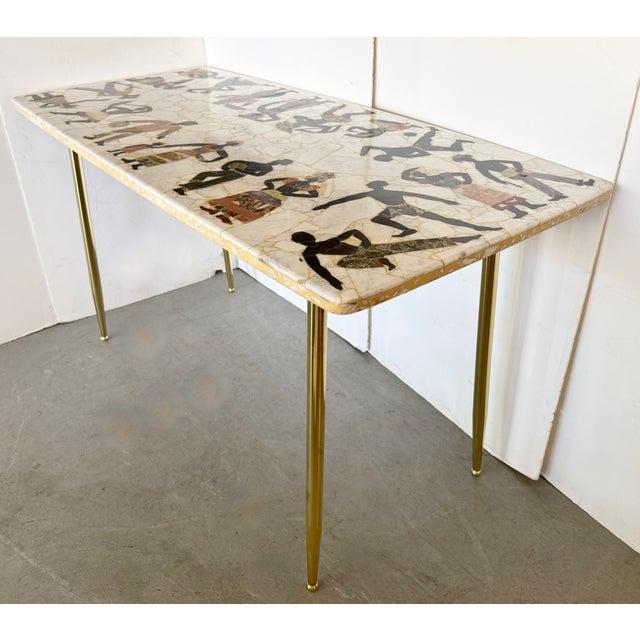 1960's stunning stone mosaic console table, featuring a intricate inlay pattern of stylized figures. Perfect as small...