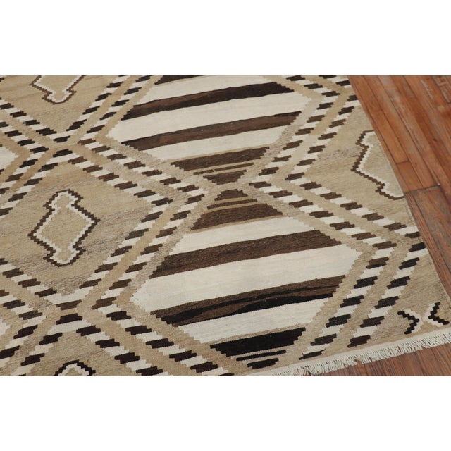 Late 20th-century geometric kilim in brown, ivory and camel tones. Measures: 8'3'' x 10'7''