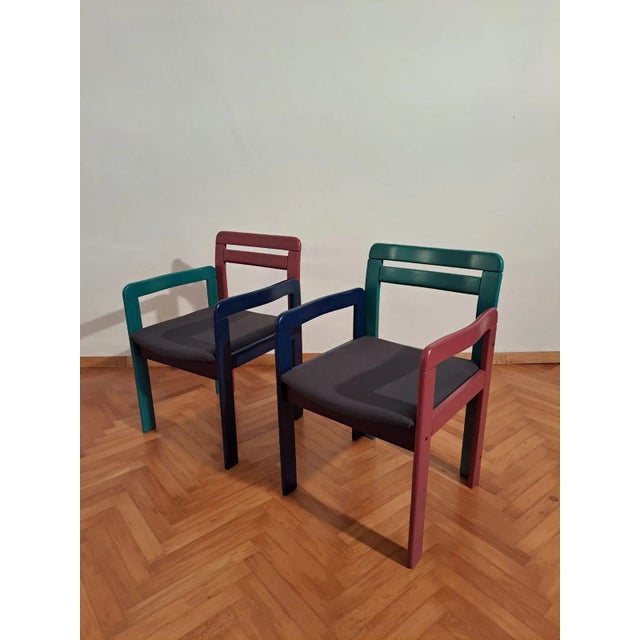 A stunning pair with multicolored chairs and table from the wild decade 1980s. The legs and the back are coated with...