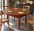 This Hand Painted Farmhouse Table is a memorable 57-inch round dining table transformed by a beautifully executed magnolia...