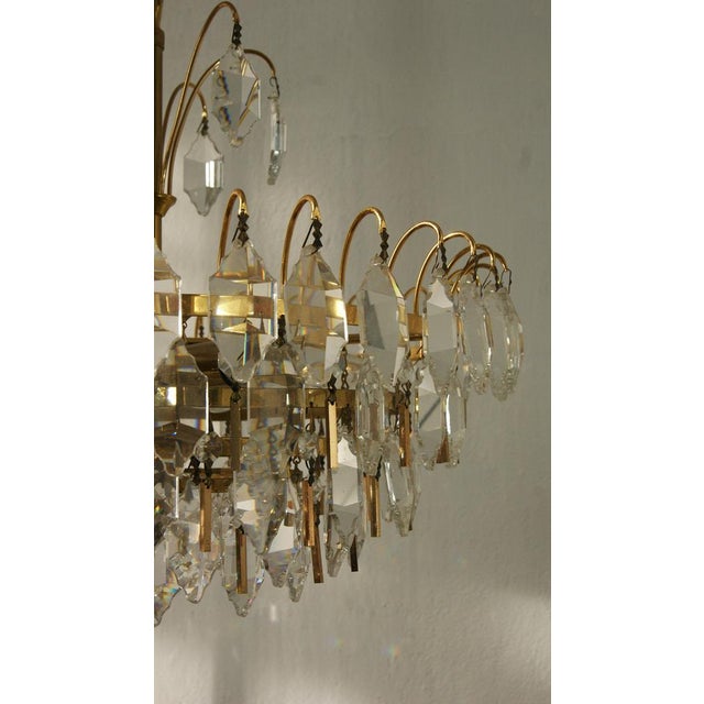 This beautiful brass and crystal glass ceiling light manufactured by Palwa impresses with a distinctive look that...