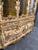 Monumental Rococo Revival china cabinet and buffet featuring an exceptionally ornate cream-and-gold finish, elaborate...