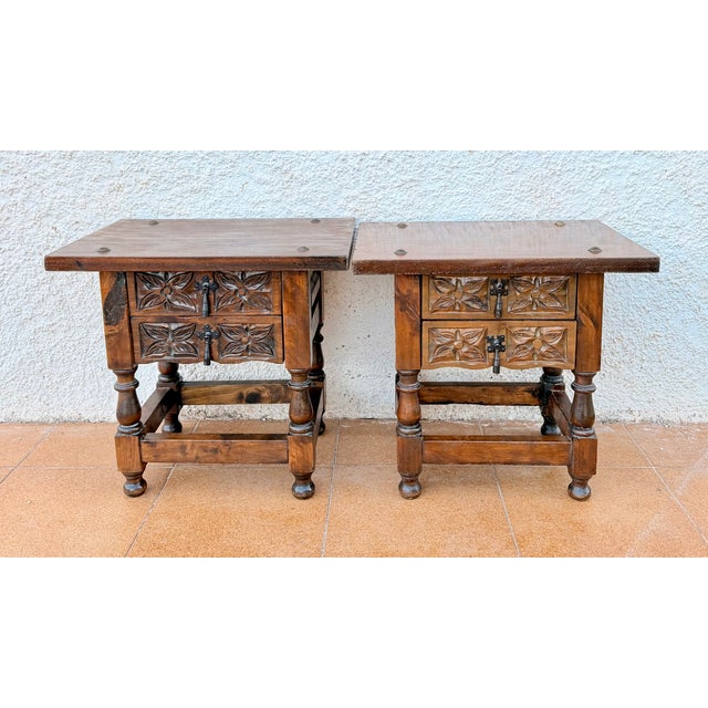 Charming pair of Spanish bedside tables dating from the mid-20th century. Crafted in wood, each table features two drawers...