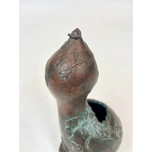 A Japanese vase for Ikebana, the art of floral arrangement. This is a unique vase in the shape of a gourd and decorated...