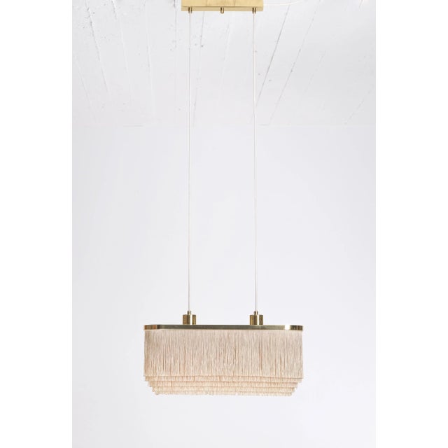 Rare model with light grey/dusty pink fringes. Produced by Hans-Agne Jakobsson, Markaryd, Sweden, 1960s. Height is...