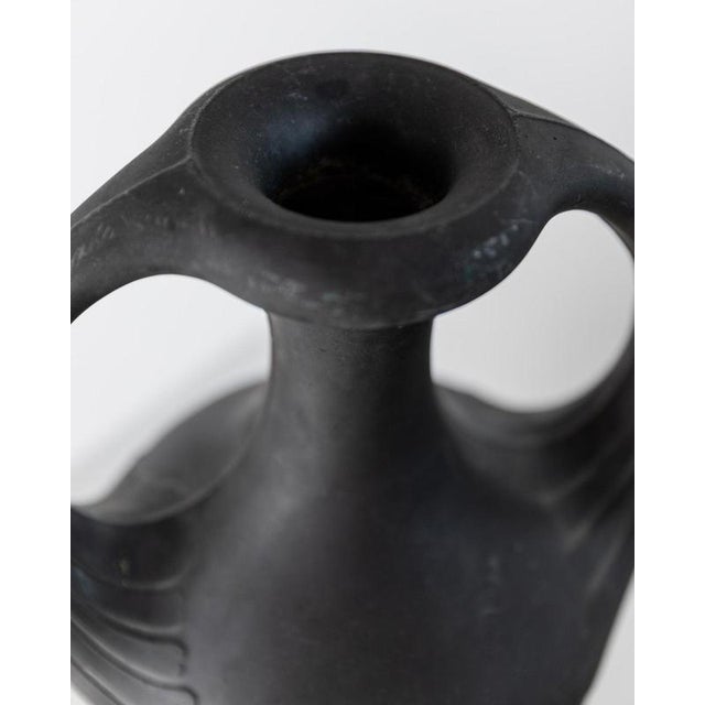 This antique Lavanite stone vase from the 1920s is a striking decorative object with a strong sculptural presence. Its...