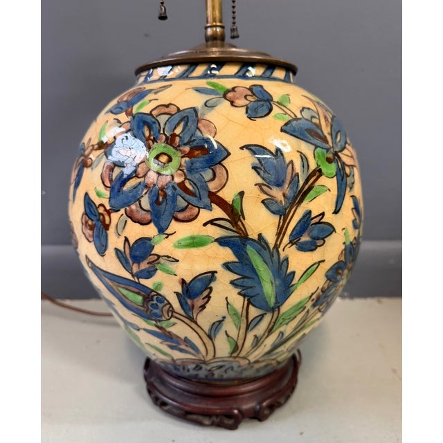 This striking Middle Eastern Qajar-period ceramic vase, dating from the late 19th to early 20th century, has been later...