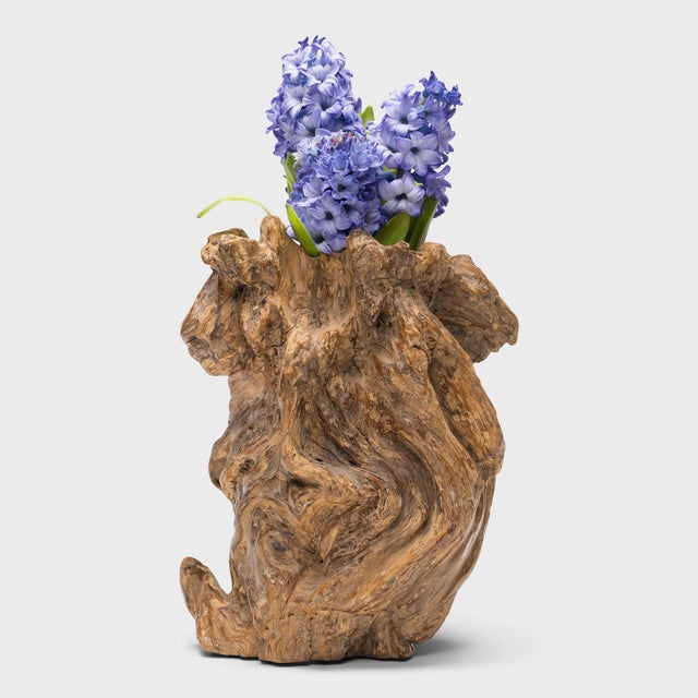 Carefully carved from a cypress tree burl, this late 19th-century burlwood vessel is known as a brush pot, a container...