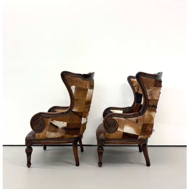 Cream Vintage Carved Wood Patchwork Cowhide Wingback Chairs - Pair For Sale - Image 8 of 9