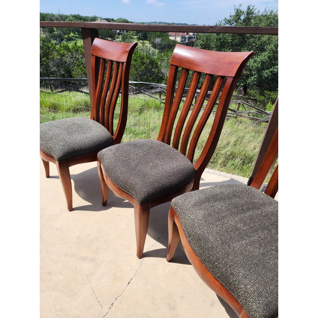 Nice looking set of four large scale side chairs...perfect for use with a game table or dining table.