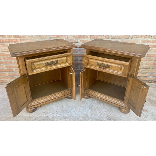 Fabulous pair of Castilian bedside tables from the 60s it has a drawer in the upper part and a door in the lower part,...