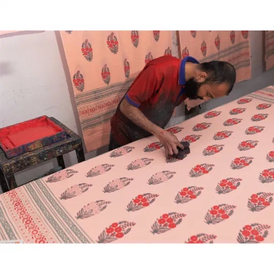 Roza showcases the fragrant tropical Gardenia flower translated into a classic Mughal motif, captured in effervescent pink...