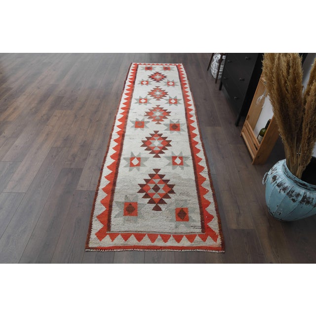 Vintage Persian Hand-Knotted runner rug is a semi-antique vintage runner rug. The '70s Eastern region of Anatolian's...