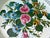 Pretty, round vintage white floral tole painted tray with a wide reticulated rim. Center if covered in. a floral leaf...