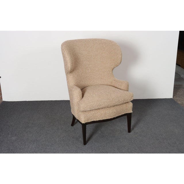 Elegant, scarcely seen wingback chair by Edward Wormley for Dunbar model 103B (ca. 1941, USA). Composed of a stained...