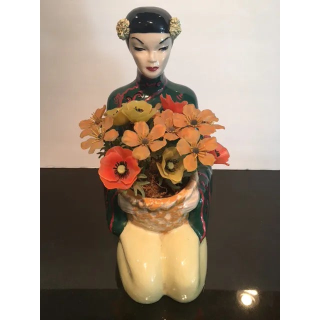 Peaceful statue by Fred Kaye of Hollywood Pottery. Very Vintage. The plastic flowers are special too.