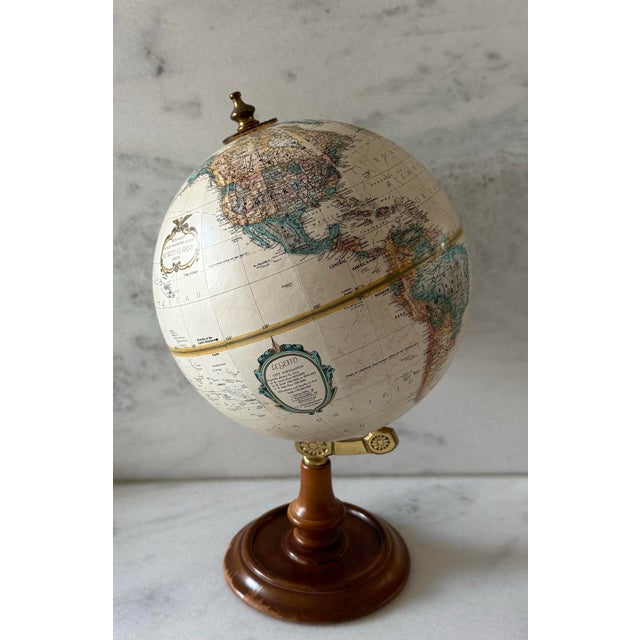 Vintage Replogle 9" "World Classic Series" globe with raised relief, wood base and brass details. Made in the USA circa...