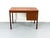 Danish teak desk with three drawers. Clean-lined design in a compact size, ideal for small spaces. • Manufacturer: Domino...