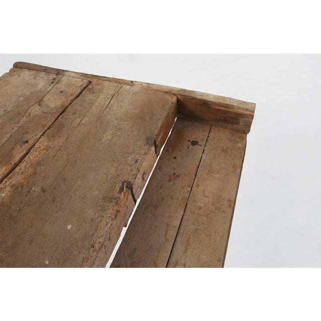 A powerful survivor of 19th‑century Belgian craftsmanship, this rustic oak workbench, dating to around 1850. This table...