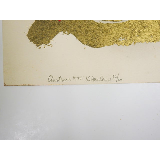 1975 serigraph on heavy paper in metallic gold and red. Unto Us a Child is Born, Karl. Pat. Karl Josef. Signed illegibly,...