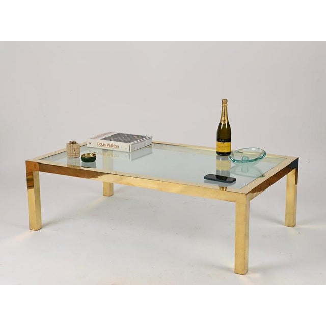 A magnificent coffee table crafted entirely from polished gilt brass and glass. This unique and incredibly elegant piece...