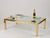 A magnificent coffee table crafted entirely from polished gilt brass and glass. This unique and incredibly elegant piece...