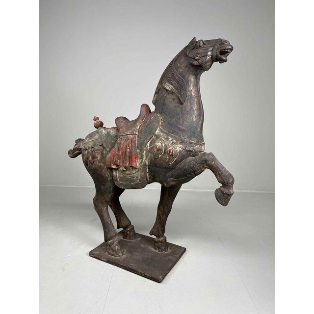 Wooden horse in the style of the Chinese Tang. Circa 1900-1920. Technique/material: wood, gesso, polychrome. Dimensions:...