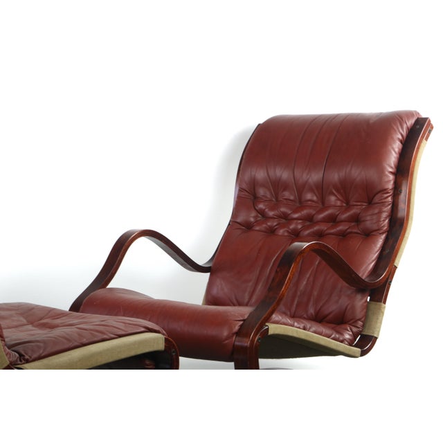 Stunning vintage dark bentwood frames, covered in comfortable and well kept original tufted oxblood leather. Ottoman...