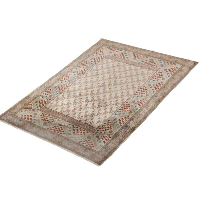 A spectacular antique 4x6 Hereke rug of hand-knotted silk and metal yarns, originating from Turkey circa 1910-1920....