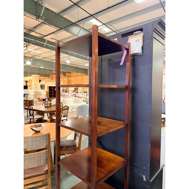 This is a refined mahogany étagère designed by Barbara Barry for Baker Furniture, showcasing her signature balance of...