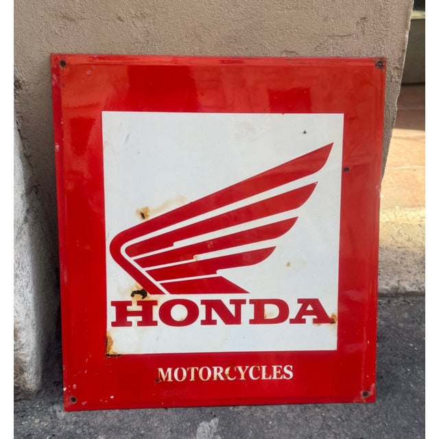 Vintage enamelled iron sign from the well-known Honda brand with some signs of wear due to the passage of time.