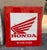 Vintage enamelled iron sign from the well-known Honda brand with some signs of wear due to the passage of time.