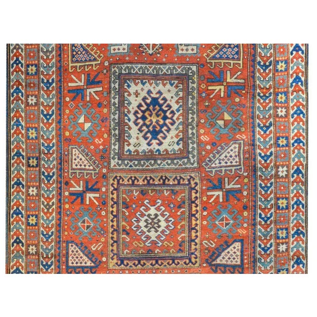An extraordinary late 19th century Persian Kazak rug with an outstanding tribal pattern containing myriad geometric...