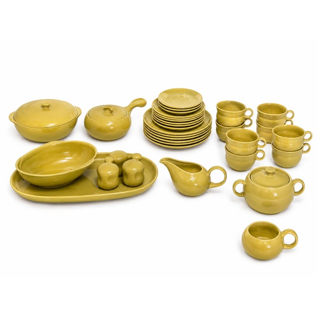 Designed by the legendary industrial designer Russel Wright, this authentic American Modern dinnerware collection was...