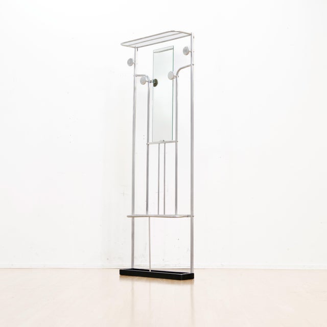 A striking vintage aluminum coat stand dating from the 1970s, combining clean modern lines with practical everyday...