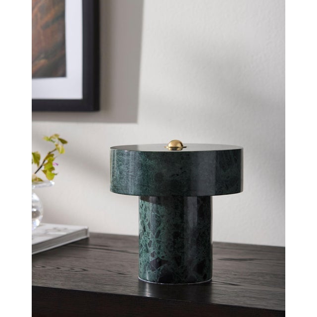 Illuminate your space with the Tessari accent table lamp, a perfect embodiment of minimalist modern design. Standing at a...