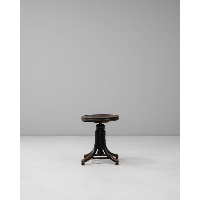 This 1920s Austrian industrial wooden swivel stool features a robust, utilitarian design that reflects early 20th-century...