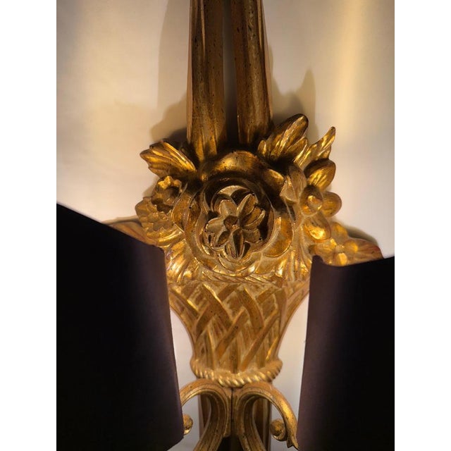 This beautiful wall lamp was produced in Belgium, it is made of light synthetic foam and gilded by hand and is visually...