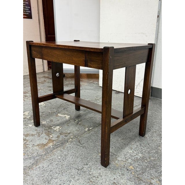 Design Plus Gallery presents an and Antique Desk. This wooden desk is a timeless piece, showcasing classic craftsmanship...