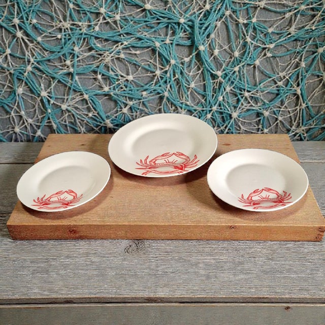 The Coastal Sea Life Three Red Crab Porcelain Serving Dishes set includes three round serving plates featuring a coastal...