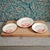 The Coastal Sea Life Three Red Crab Porcelain Serving Dishes set includes three round serving plates featuring a coastal...