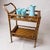 This beautifully preserved vintage rattan bar cart dates from the mid-century era (1950s–70s) and features a handwoven...