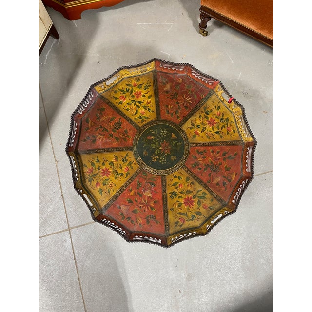 A wonderfully colorful round-shaped lacquered tole tray that sits on a new custom made stand so as to function as a small...