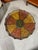 A wonderfully colorful round-shaped lacquered tole tray that sits on a new custom made stand so as to function as a small...