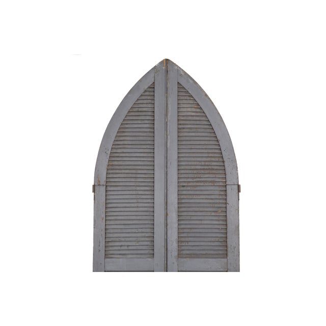 PAIR OF WEATHERED GRAY-PAINTED ARCHED DOME LOUVERED DOORS American, circa 19th century Item # 203MEK04P A vibrant pair of...